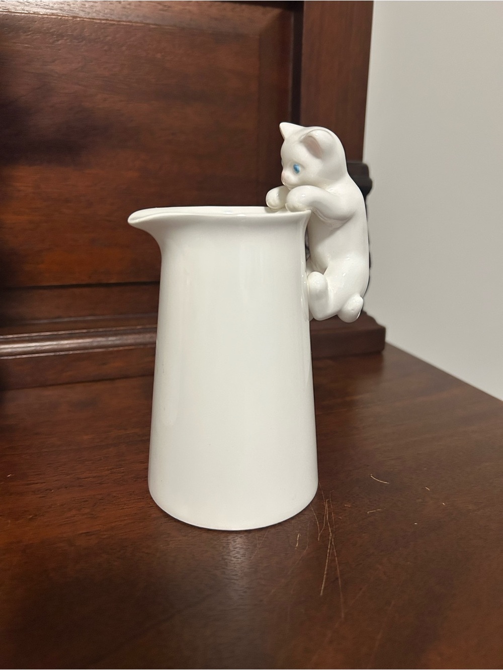 Vintage White Porcelain creamer with Climbing Cat Accent as handle.